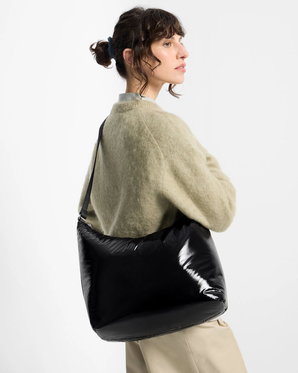 Wouf Night Hobo Bag - in a model's hand